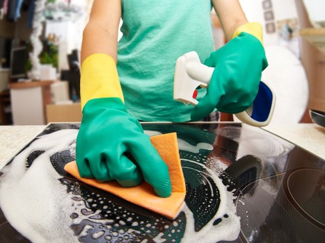 Professional mattress cleaning equipment in use on a bed