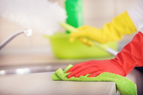 Trained carpet cleaner using protective equipment during service